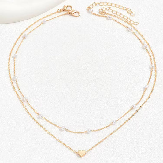 Twin Pearl Herz-Halskette – Doppellagige Eleganz in Gold