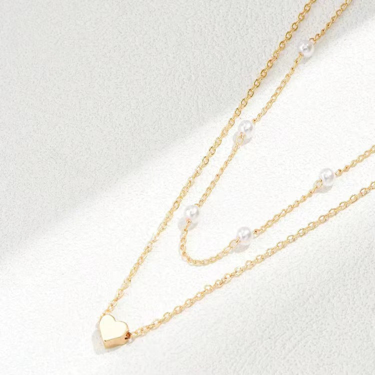 Twin Pearl Herz-Halskette – Doppellagige Eleganz in Gold