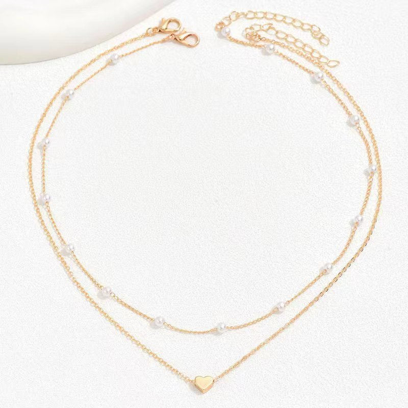 Twin Pearl Herz-Halskette – Doppellagige Eleganz in Gold