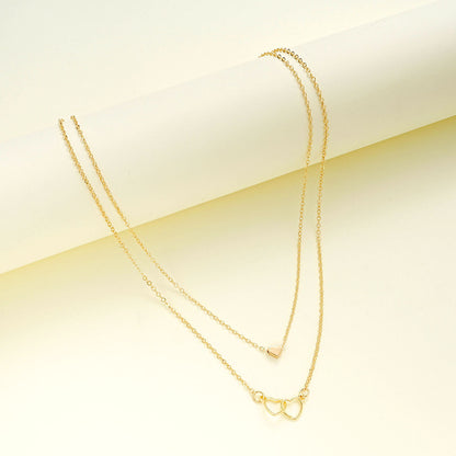 Doppelte Herzkette – Elegantes Design in Gold