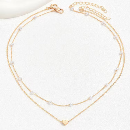 Twin Pearl Herz-Halskette – Doppellagige Eleganz in Gold
