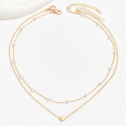Twin Pearl Herz-Halskette – Doppellagige Eleganz in Gold